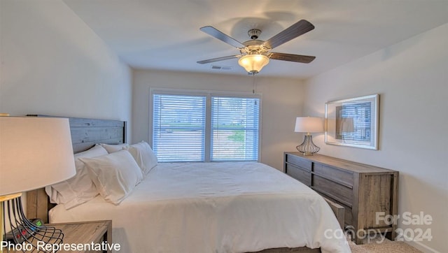 bedroom with visible vents and a ceiling fan