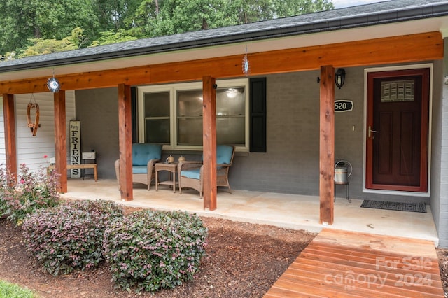 doorway to property featuring a porch