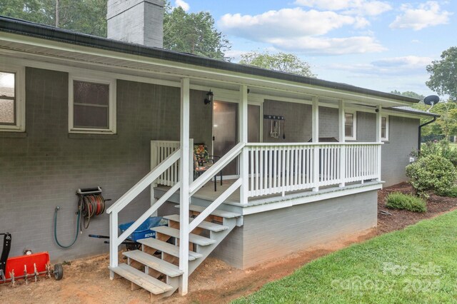 entrance to property with a porch