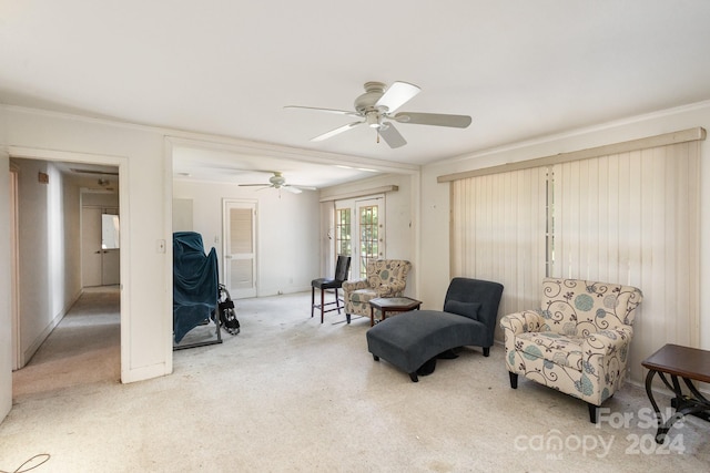 living area with ceiling fan, french doors, and crown molding