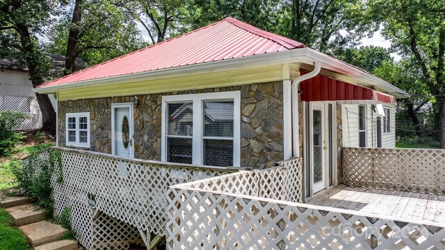 view of home's exterior featuring a deck