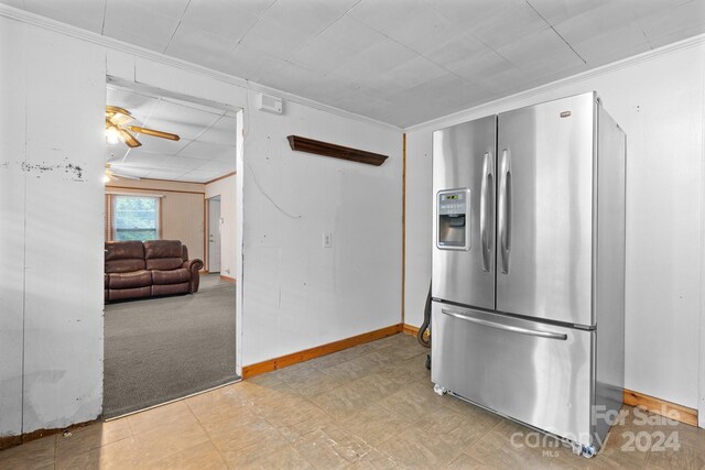 kitchen featuring light carpet, stainless steel refrigerator with ice dispenser, and ceiling fan