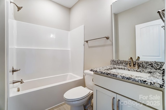 full bathroom featuring toilet,  shower combination, and vanity