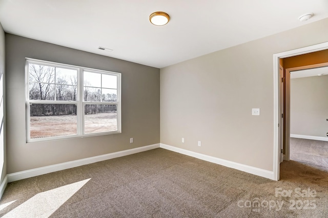 unfurnished room with carpet floors