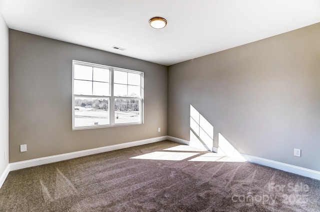 empty room with carpet flooring