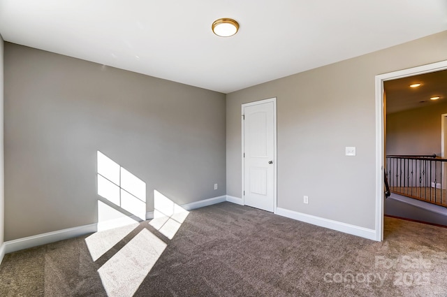 unfurnished room featuring carpet flooring