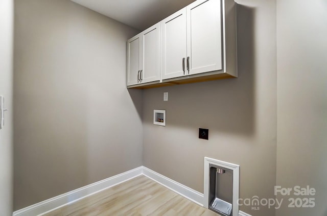 laundry area with washer hookup, cabinets, light wood-type flooring, and electric dryer hookup