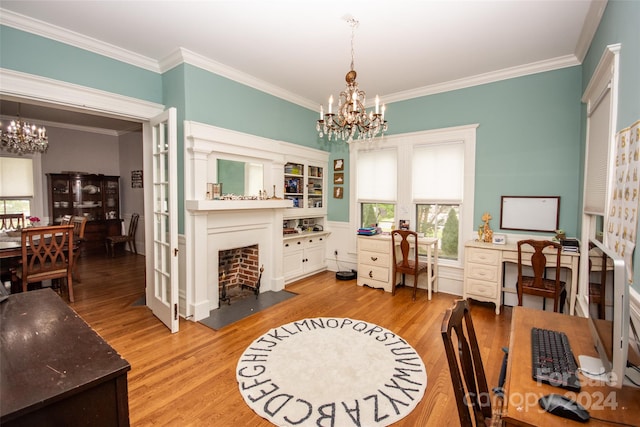 interior space with an inviting chandelier, ornamental molding, and light wood-type flooring