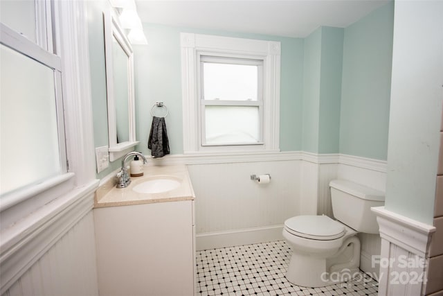 bathroom featuring vanity and toilet