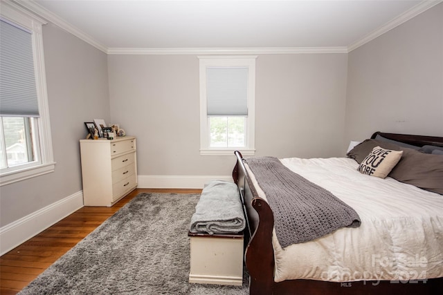 bedroom featuring hardwood / wood-style flooring and ornamental molding