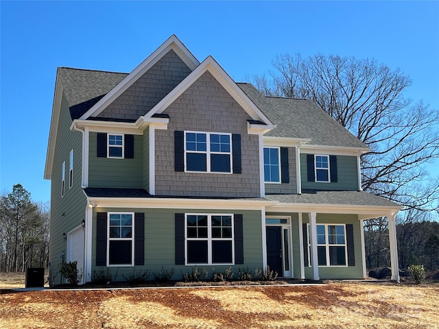 view of front of house featuring a garage and covered porch