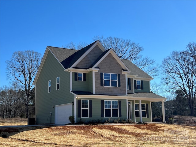 view of front of house featuring a garage and a porch