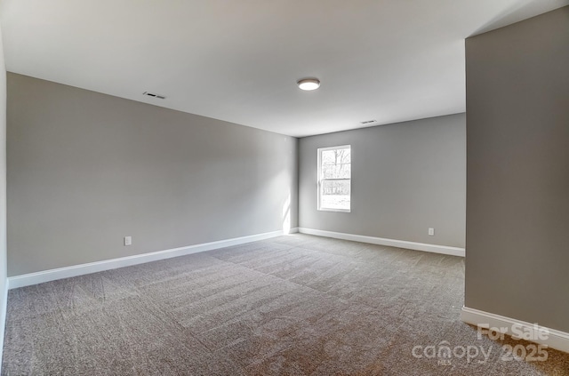 unfurnished room with carpet floors