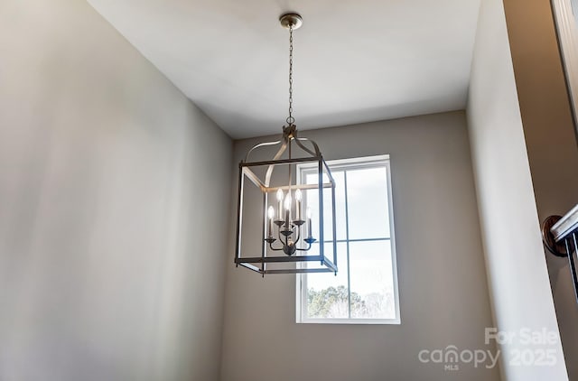 interior details featuring a chandelier