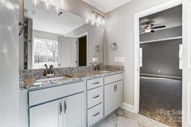 bathroom featuring ceiling fan and vanity