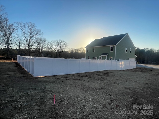 view of property exterior at dusk