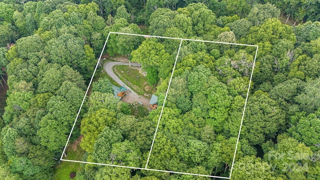 aerial view featuring a wooded view