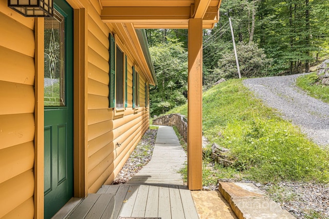 exterior space with log veneer siding