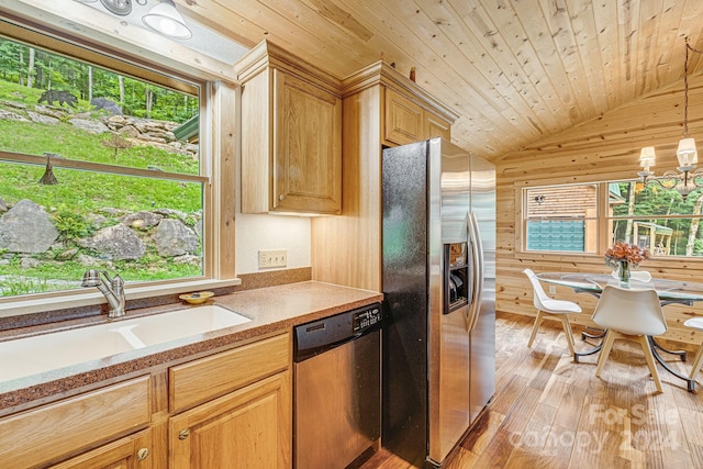 kitchen featuring wood ceiling, vaulted ceiling, stainless steel appliances, light wood-type flooring, and a sink