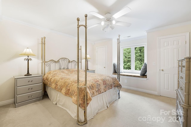 carpeted bedroom featuring crown molding, ceiling fan, and a closet