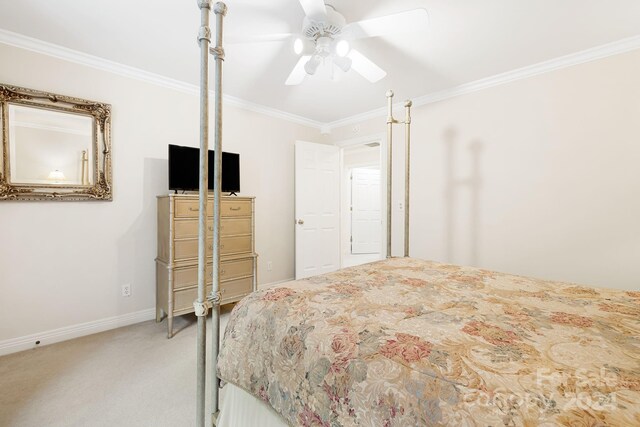 bedroom with crown molding, ceiling fan, and carpet flooring