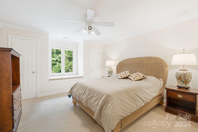 bedroom with crown molding, ceiling fan, and light colored carpet