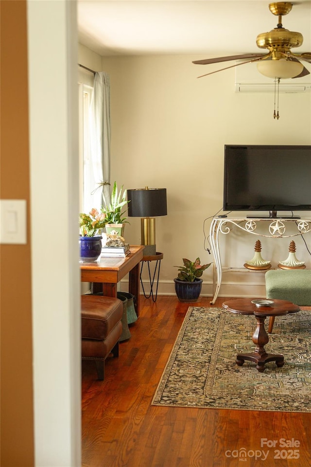 interior space with ceiling fan, dark wood-type flooring, and baseboards