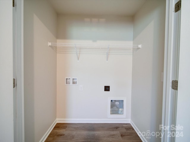 clothes washing area featuring hookup for an electric dryer, washer hookup, and hardwood / wood-style flooring