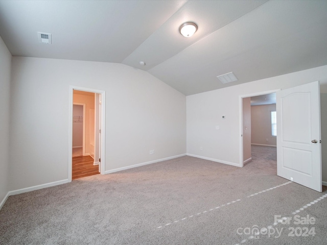 interior space with hardwood / wood-style floors and lofted ceiling