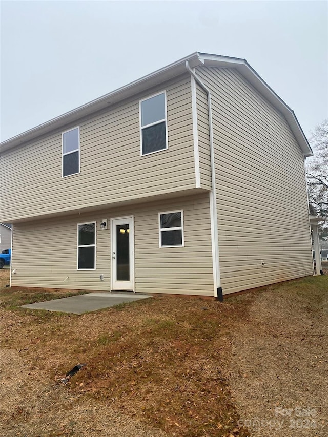 rear view of property featuring a patio area