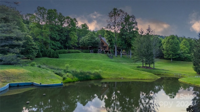 exterior space featuring a water view and a yard