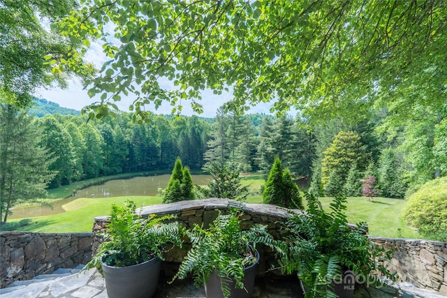 view of patio with a water view