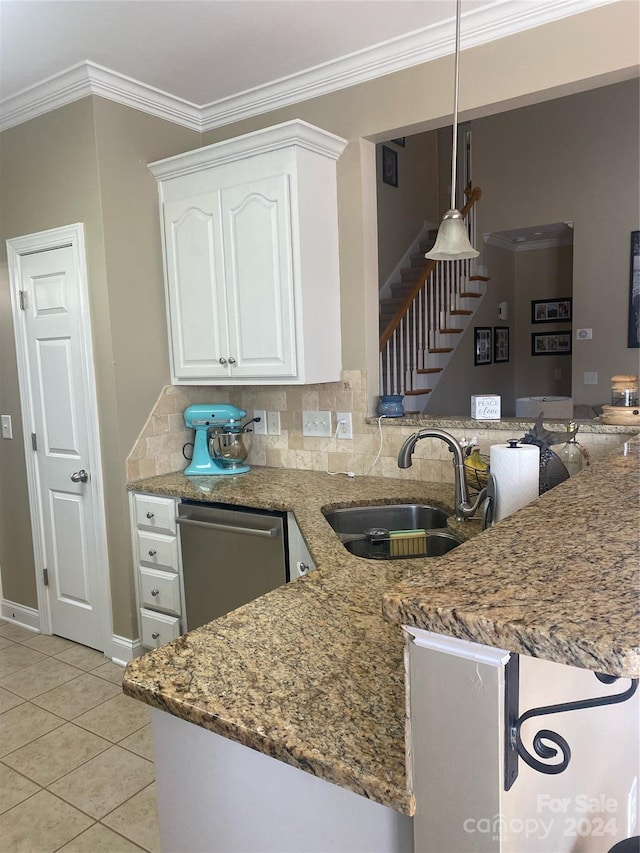 kitchen with stone counters, white cabinets, dishwasher, kitchen peninsula, and backsplash