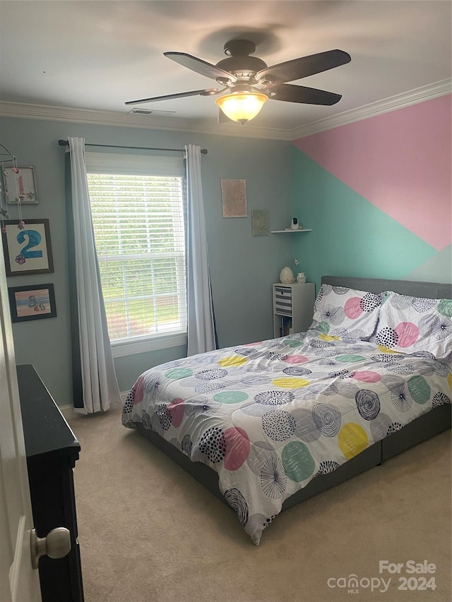 bedroom with carpet flooring, ornamental molding, and ceiling fan