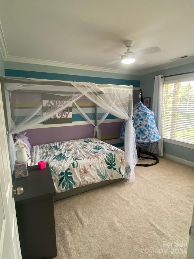 bedroom with crown molding, carpet floors, and ceiling fan