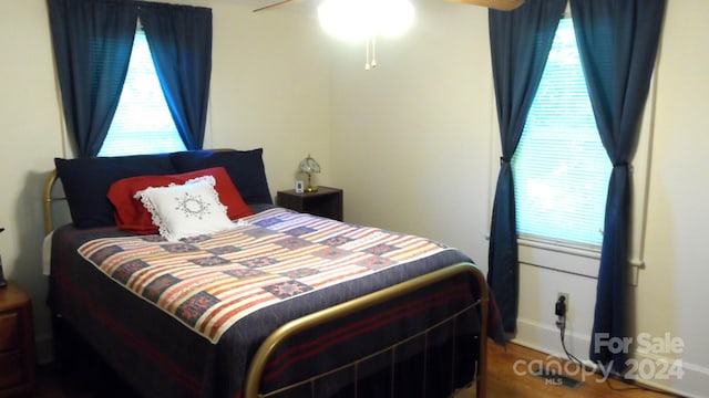 bedroom featuring ceiling fan and hardwood / wood-style floors