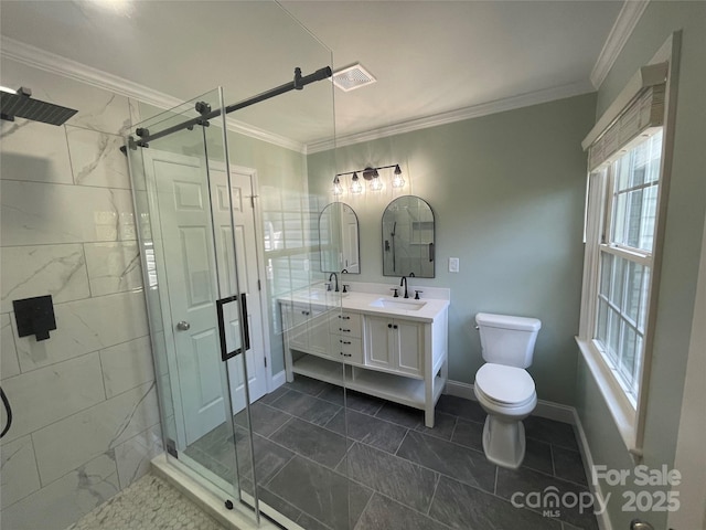 bathroom with ornamental molding, toilet, a shower with shower door, and vanity