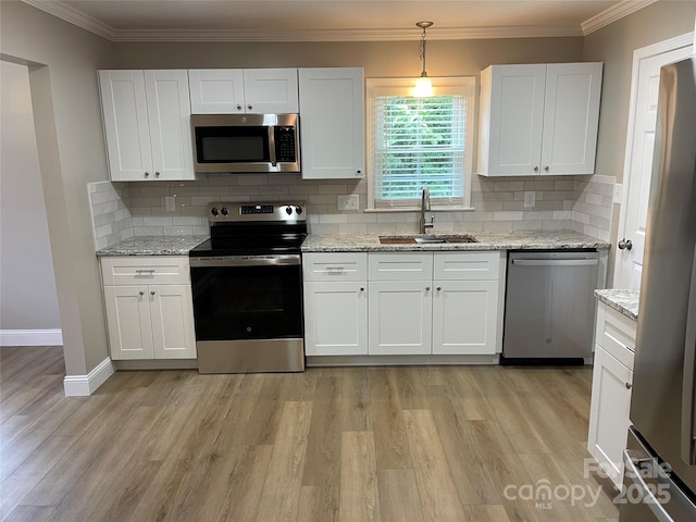 kitchen featuring white cabinetry, appliances with stainless steel finishes, and sink