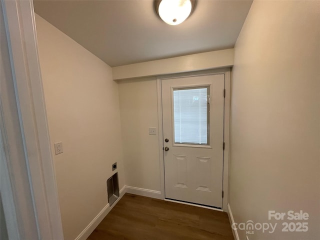 entryway with dark hardwood / wood-style flooring