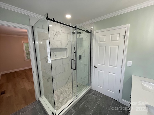 bathroom with an enclosed shower and crown molding