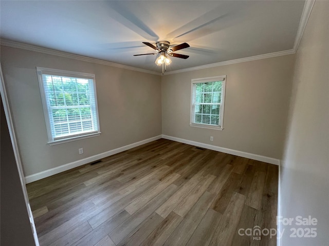 empty room with crown molding, ceiling fan, and hardwood / wood-style floors