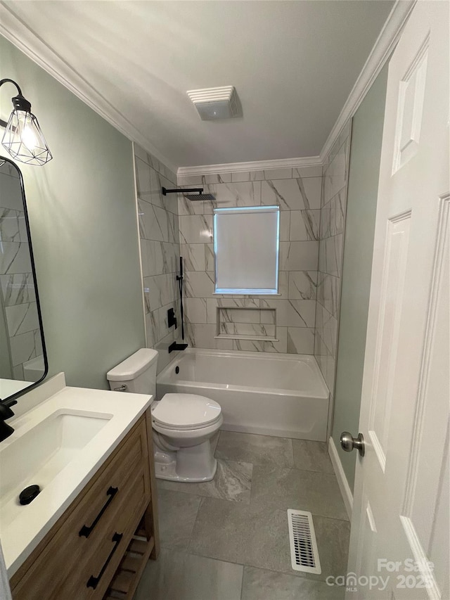 full bathroom featuring ornamental molding, toilet, tiled shower / bath combo, and vanity