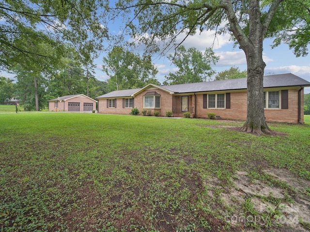 ranch-style home with a front lawn and a garage