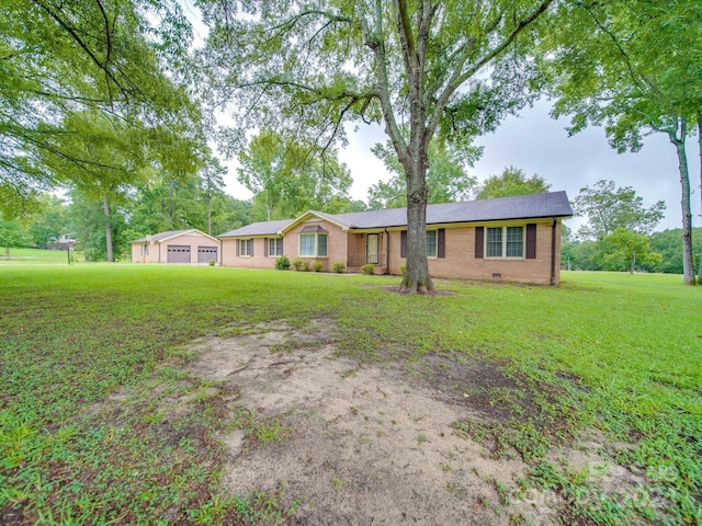 single story home featuring a garage and a front lawn