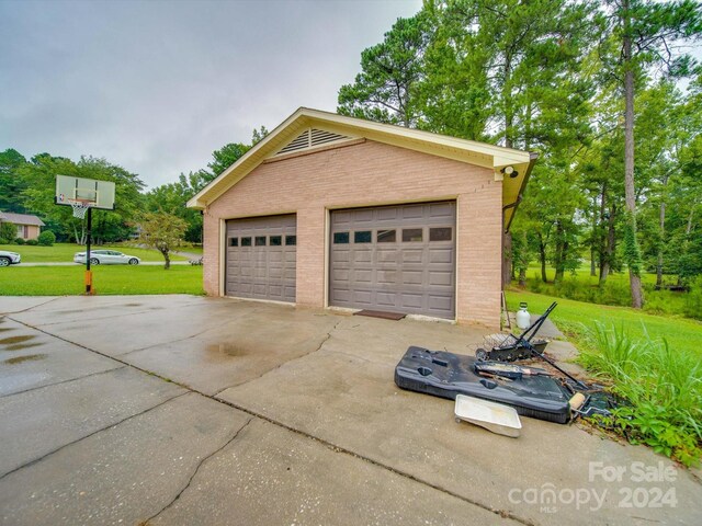 garage featuring a yard