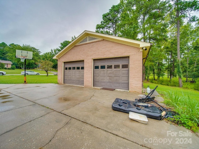 garage with a lawn