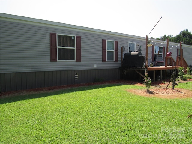 view of yard featuring a wooden deck