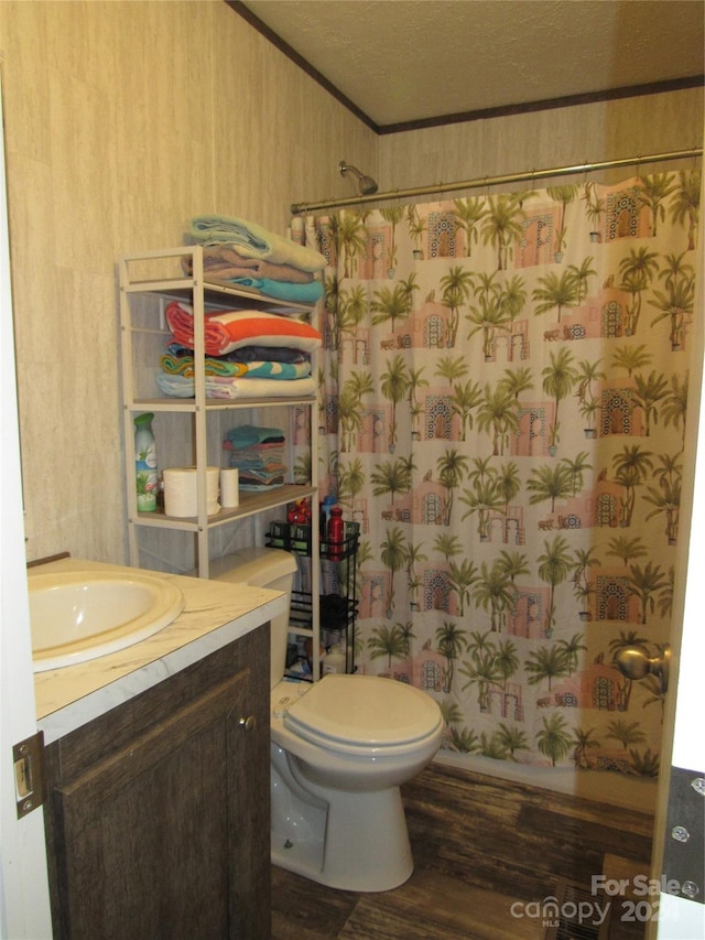 bathroom with vanity, a textured ceiling, toilet, and hardwood / wood-style floors