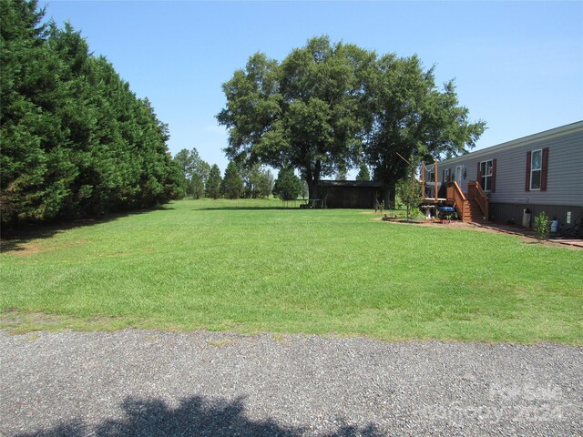 view of yard featuring a wooden deck