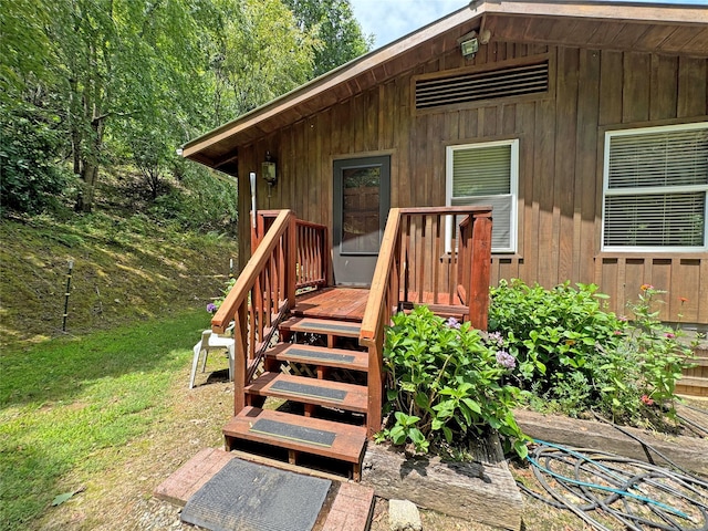 property entrance with a deck